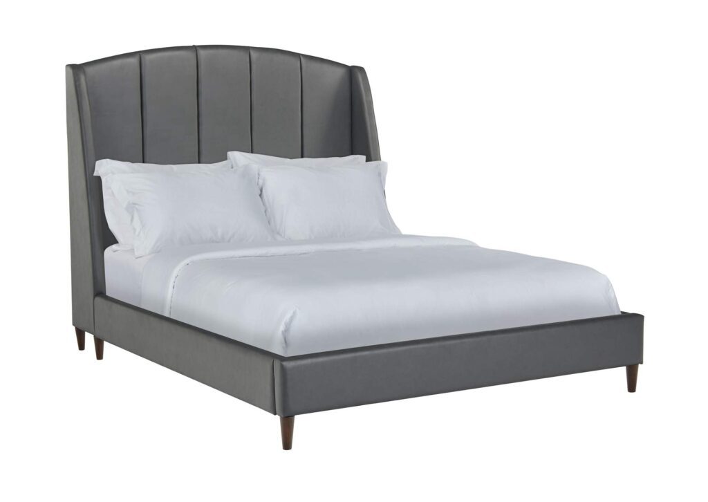 Grey coloured queen sized bed with white sheets