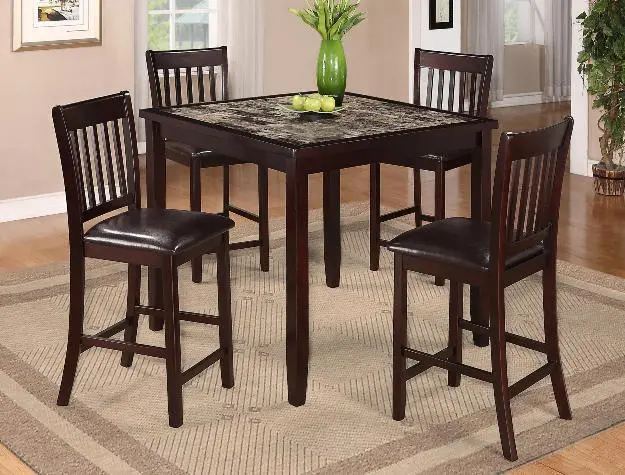 a small dining table with four chairs