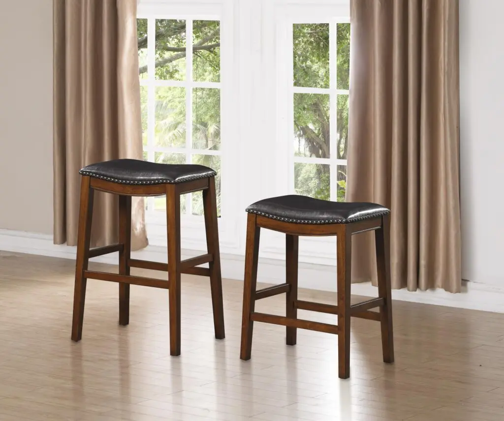 a tall and a short stool with leather seat