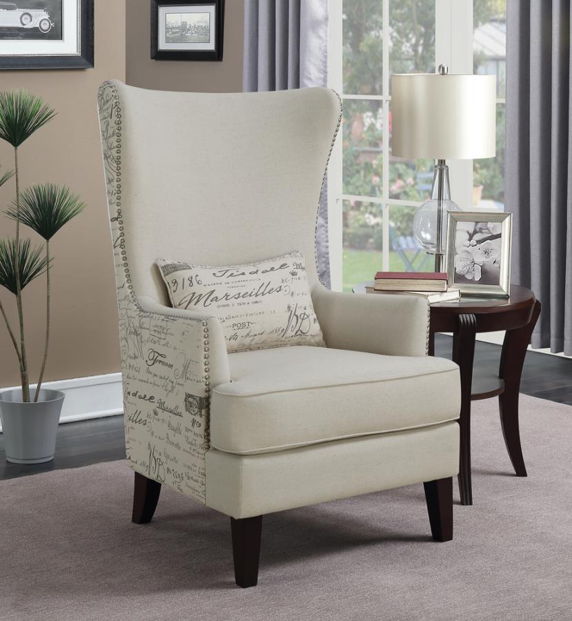 cream wing chair with a cushion