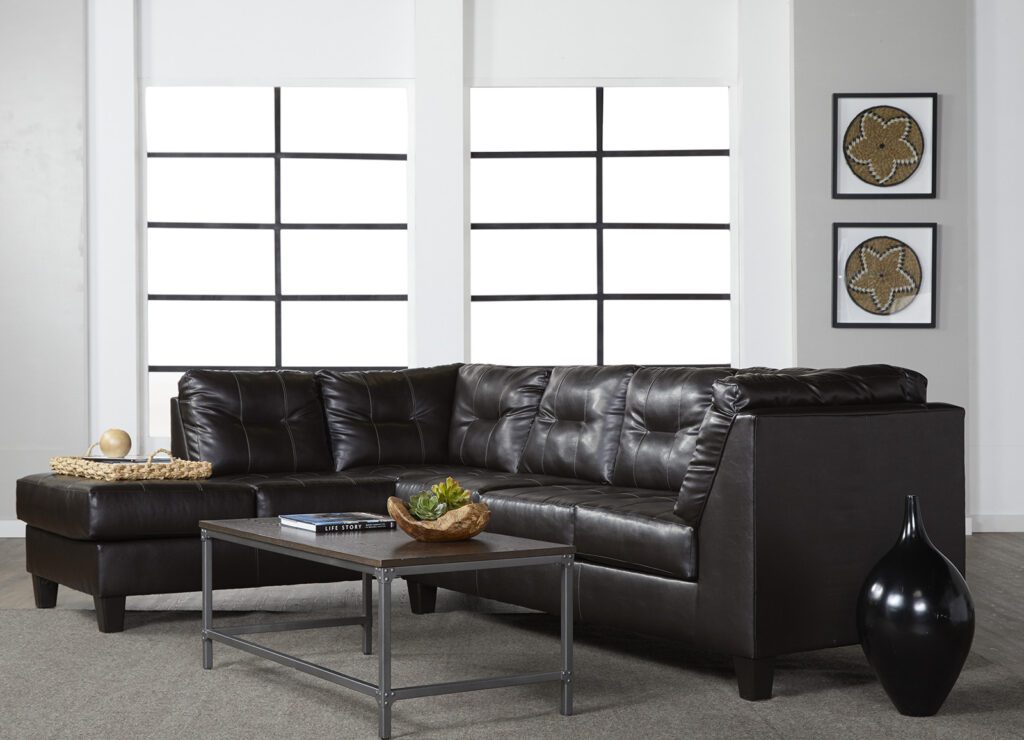 Black color leather sofa and a center table
